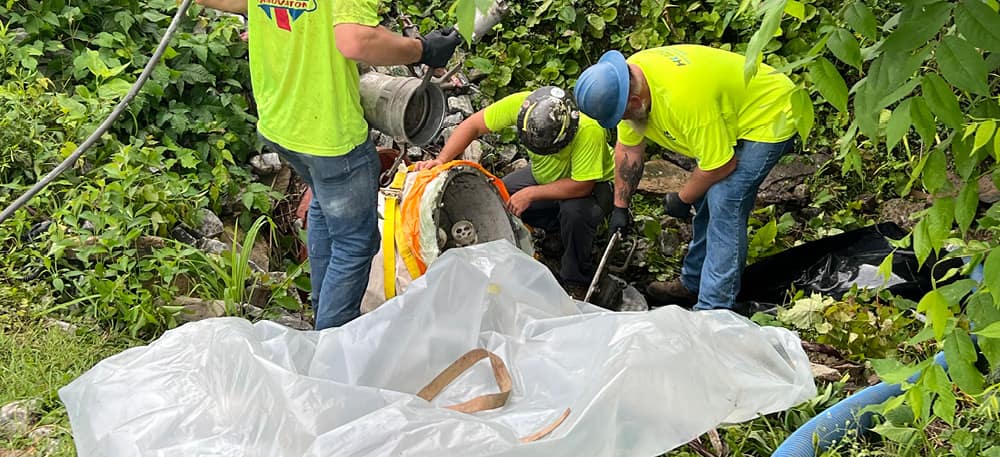 hk solutions group technicians performing culvert repair.